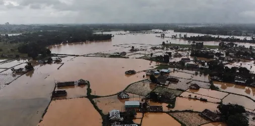 Aerial view of flooded villages and inundated agricultural land in Assam
