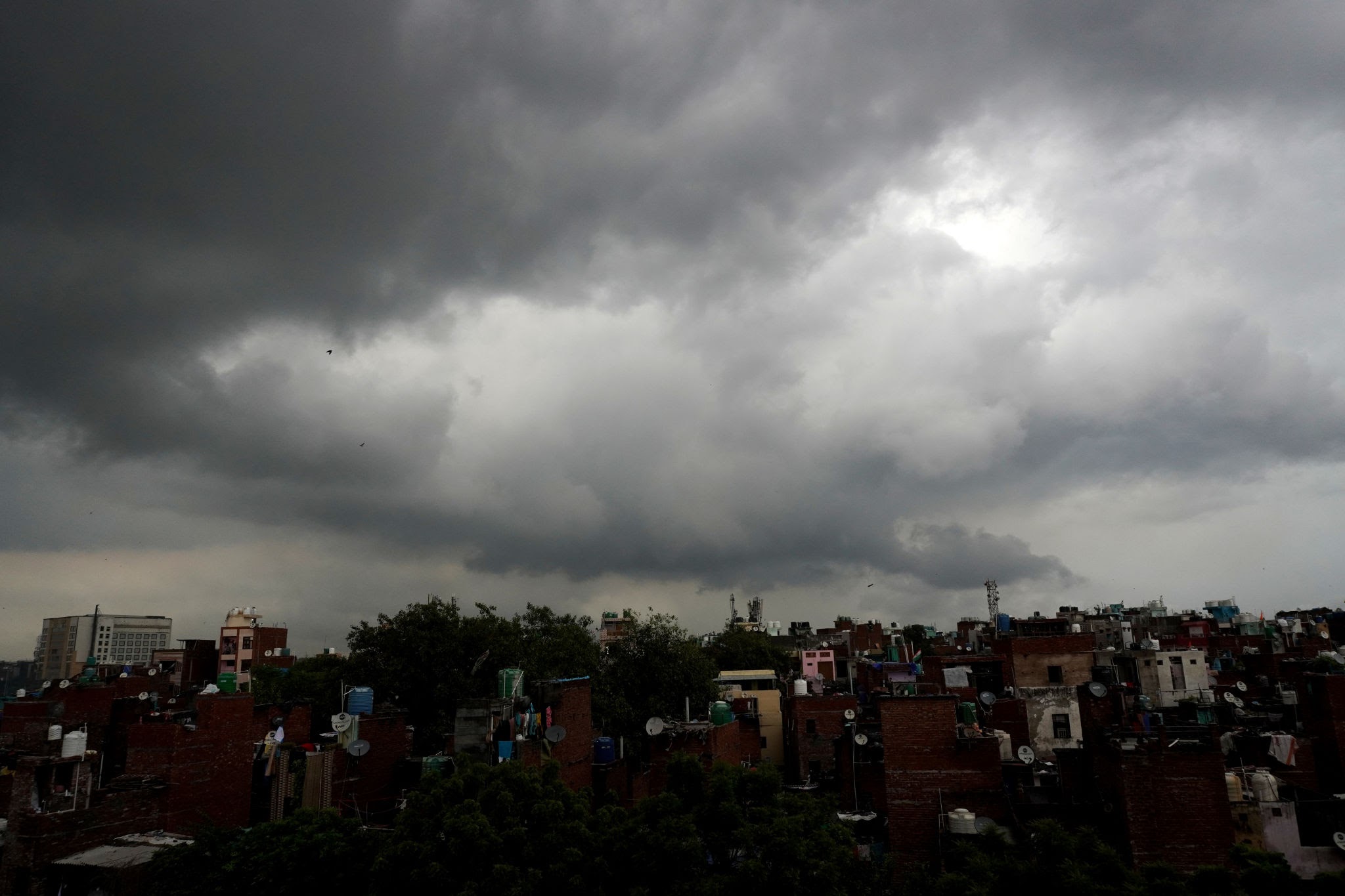 Monsoon clouds covering urban city skies as active low-pressure systems trigger widespread rainfall across Indian states