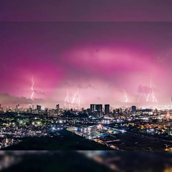 Intense nighttime thunderstorm and lightning strikes over the Mumbai city skyline