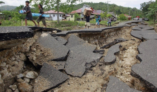 Due to the earthquake, roads are broken in Indonesia.