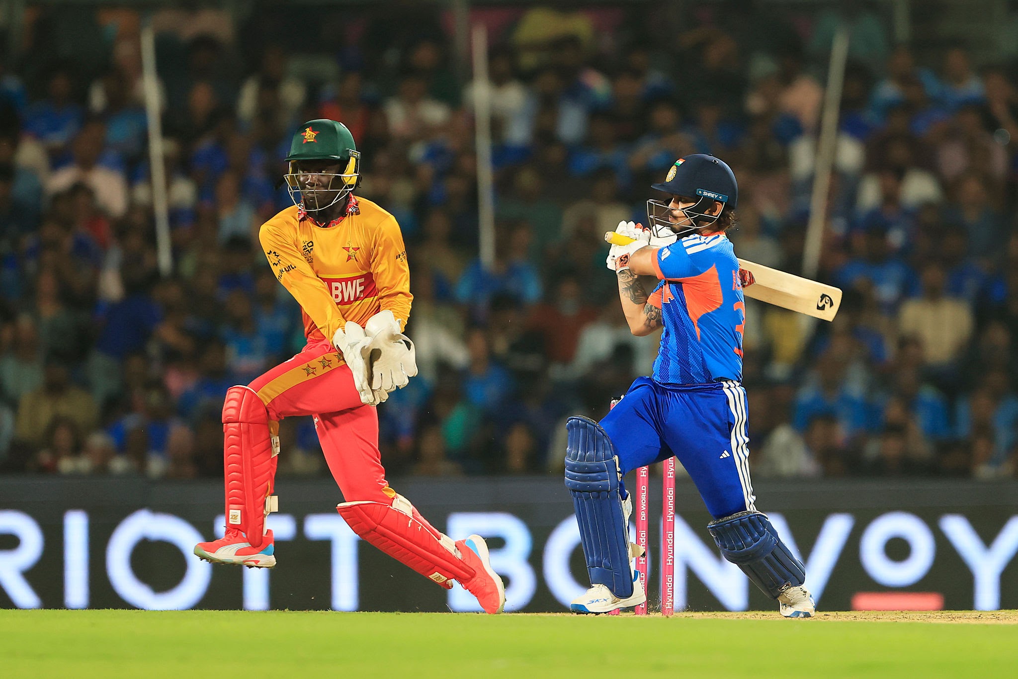 Ishan Kishan raising his bat in celebration after scoring a match-winning half-century for India