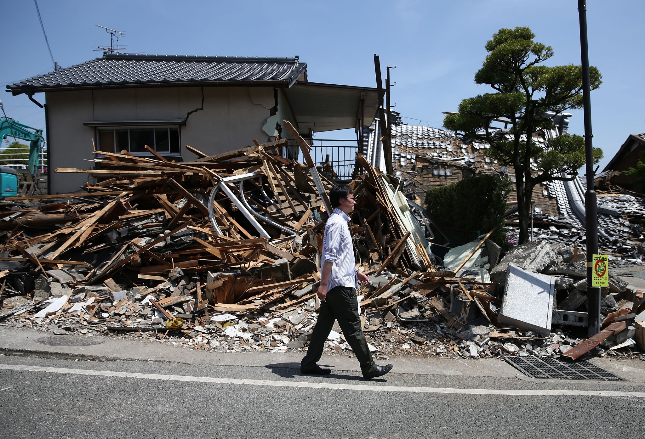 Collapsed wooden structures and rubble in Kumamoto following July 28 2026 earthquake