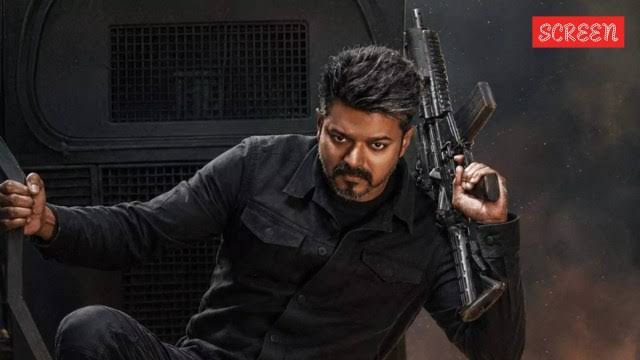 Action still of Thalapathy Vijay holding an automatic rifle in Jana Nayagan