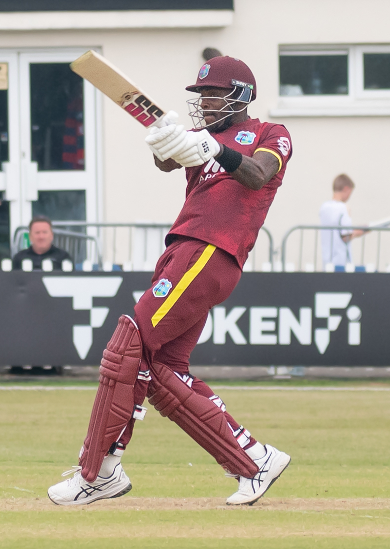 Justin Greaves batting in maroon West Indies kit