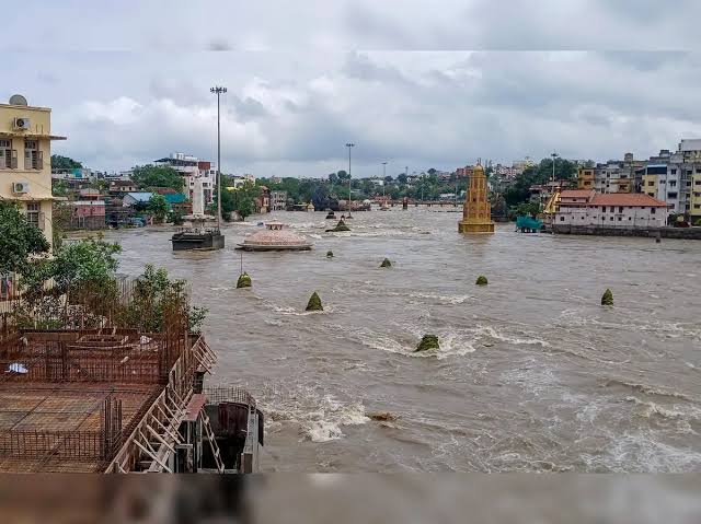 Submerged Ramkund riverbed and Dutondya Maruti idol under Godavari floodwaters