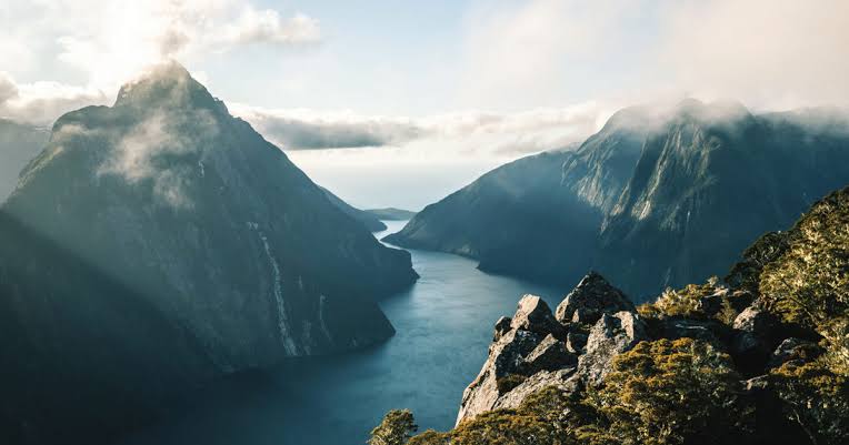 Spectacular mountain fjords and water in Milford Sound Fiordland New Zealand