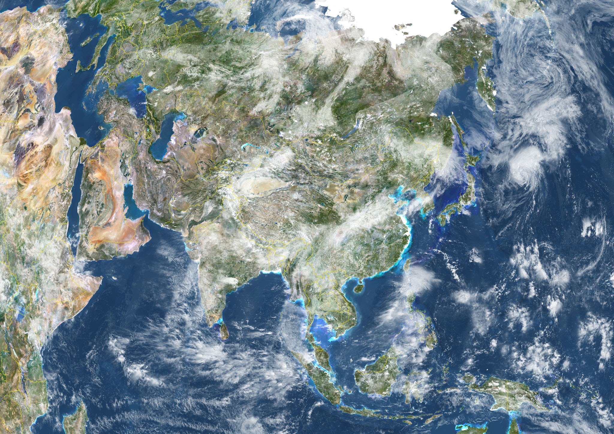 True-color satellite composite map of Asia showing monsoon cloud bands connecting India and South Korea