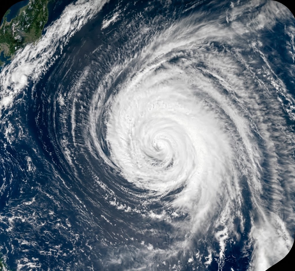 NASA satellite view of a fully formed tropical typhoon displaying a prominent eye