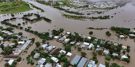 Aerial view of widespread storm surge flooding and submerged residential settlements