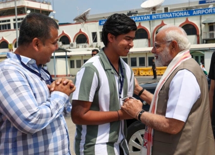 Prime Minister Narendra Modi greeting 15-year-old Vaibhav Suryavanshi and his father Sanjiv at Patna airport