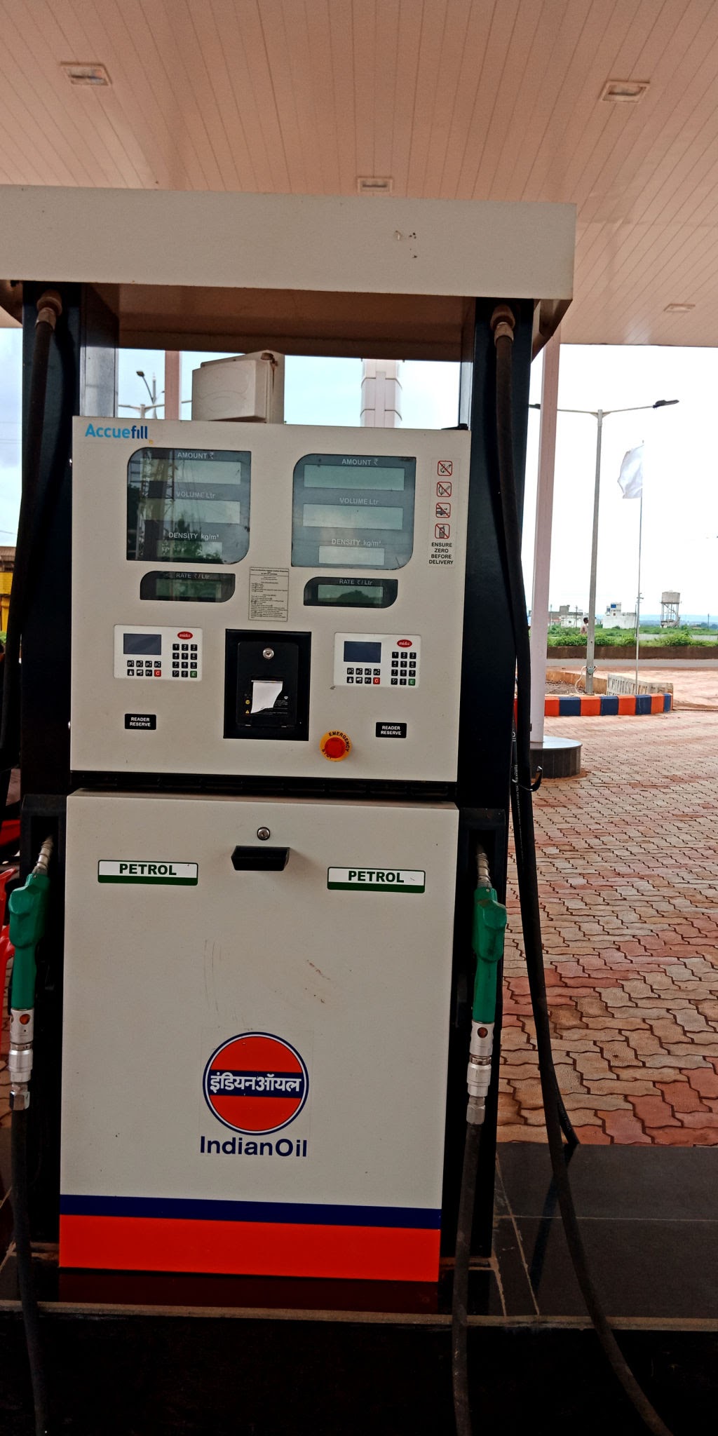 IndianOil petrol dispensing pump unit dispensing fuel at an Indian petrol station